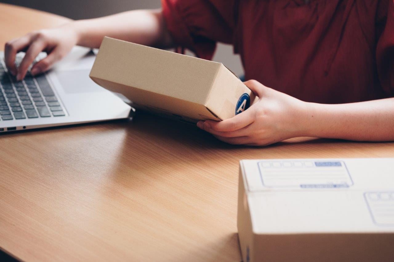 man inspecting package