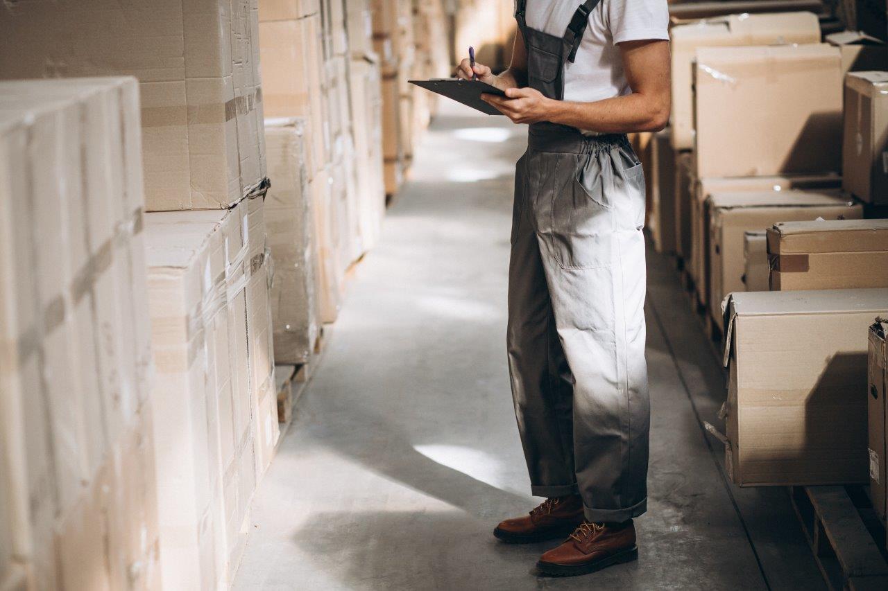 man checking warehouse inventory