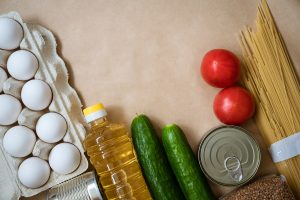 Products lie on the background, eggs cereals and vegetables