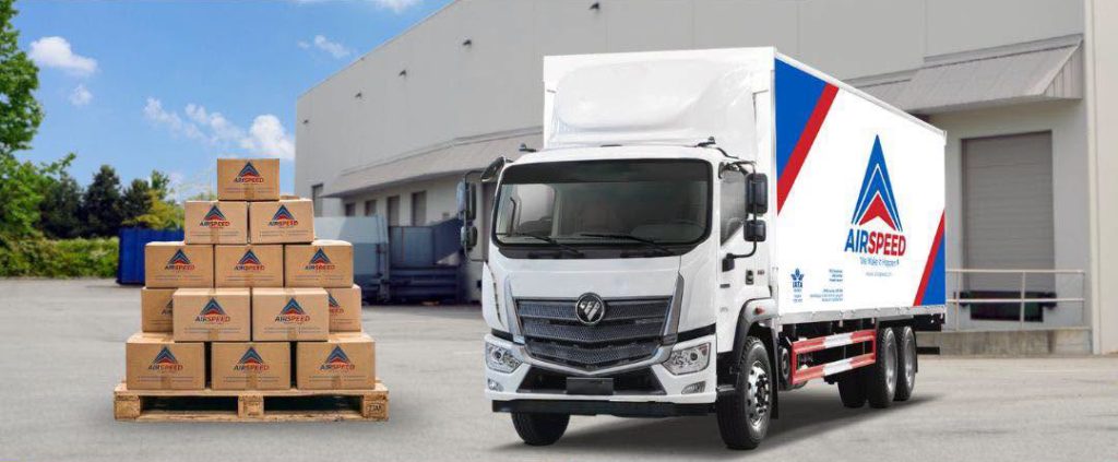Airspeed land freight forwarding truck transporting bulk cargo across the Philippines